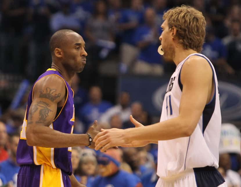 Los Angeles' Kobe Bryant and Dallas' Dirk Nowitzki shake hands before during Game 4 of the...