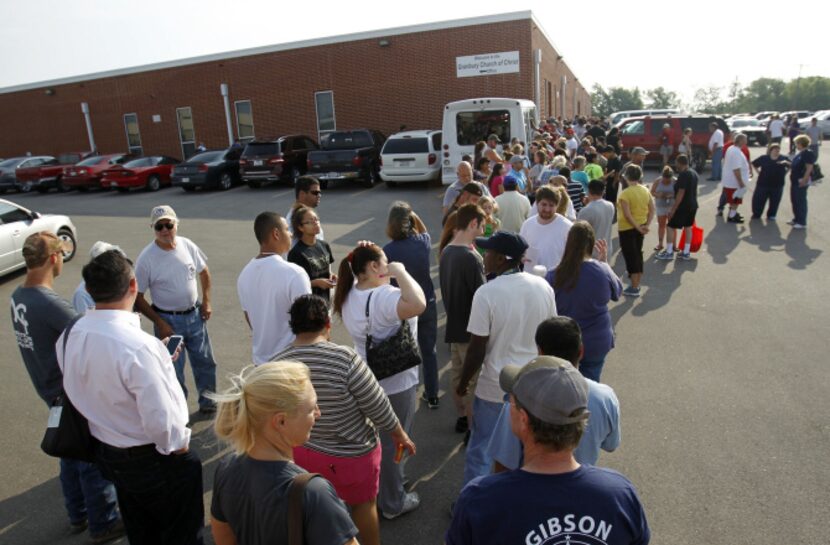 Residents waited in line outside Granbury Church of Christ for a permit to get a look at...