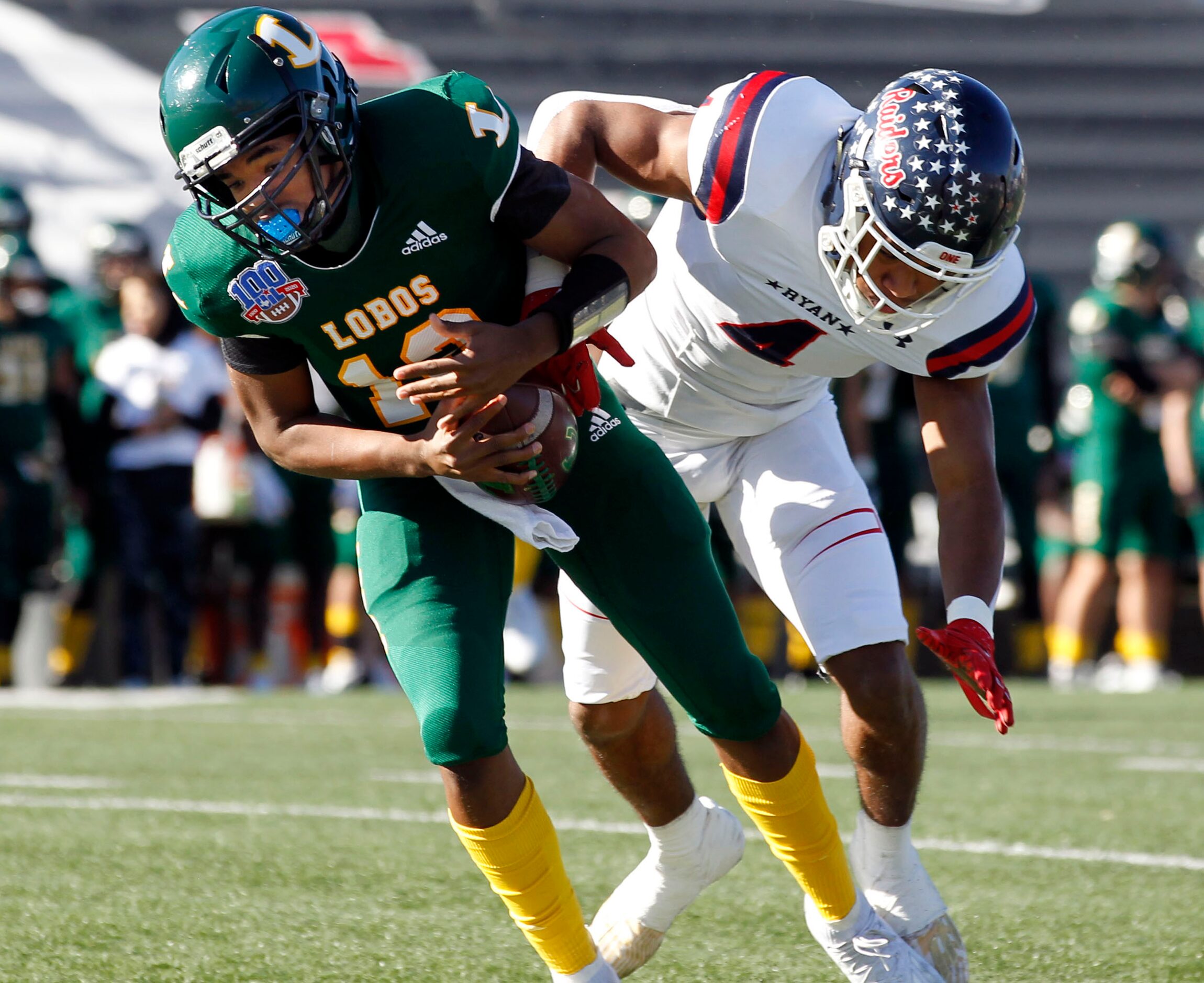 Denton Ryan defender Ty Marsh (4) bowls over Longview QB Jordan Allen (12) during the first...