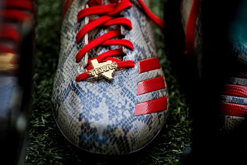 Adidas cleats that were given to teams during a Division I quarterfinals games rest in the...