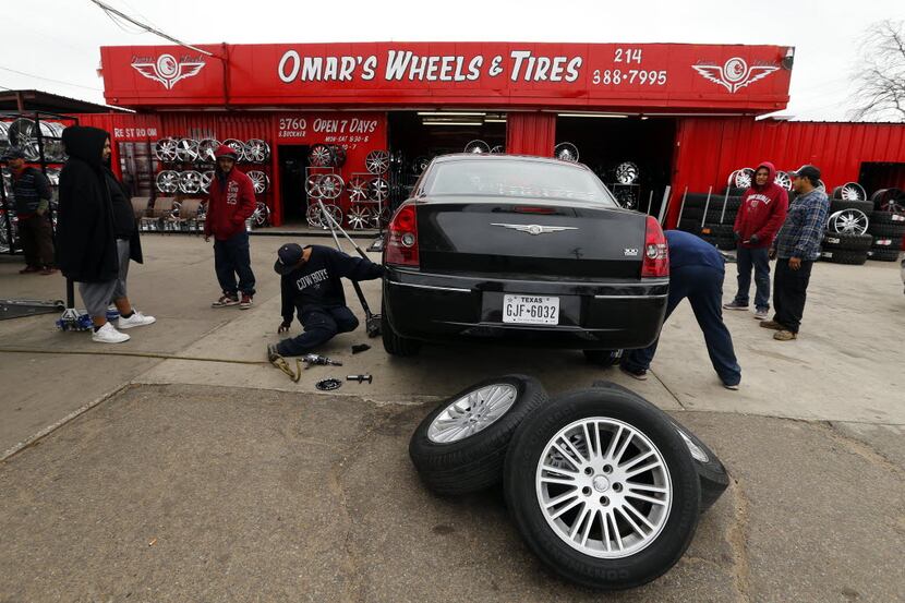 A team of technicians replaced a set of tires and rims at Omar's Wheels and Tires in Dallas....