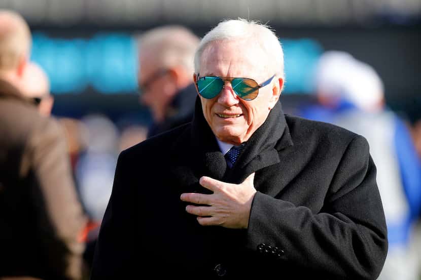 Dallas Cowboys owner Jerry Jones kept bundled up in the cold during pregame warmups before...