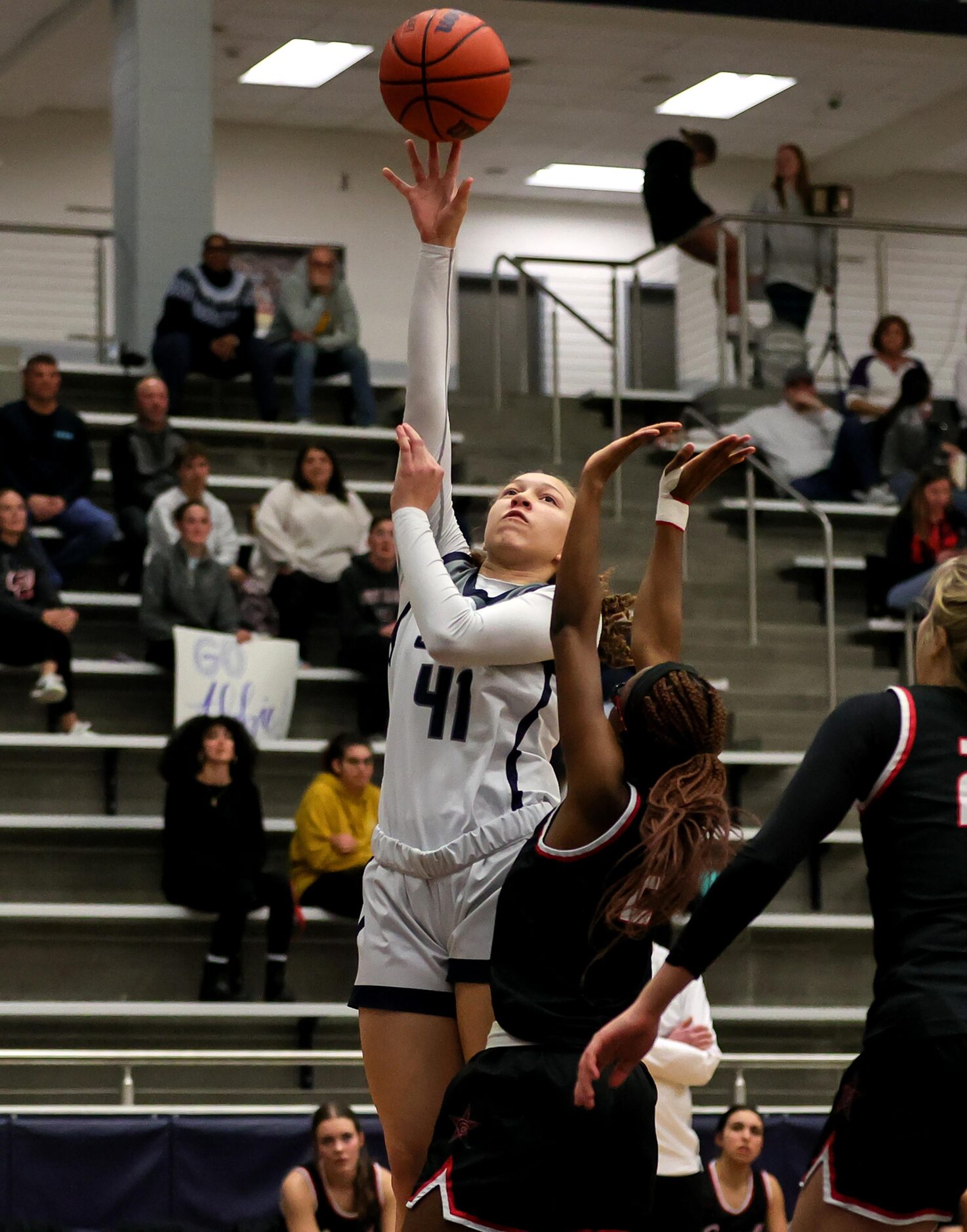 Flower Mound guard Kaitlyn Edmondson (41) gets a shot off over Coppell during the first half...