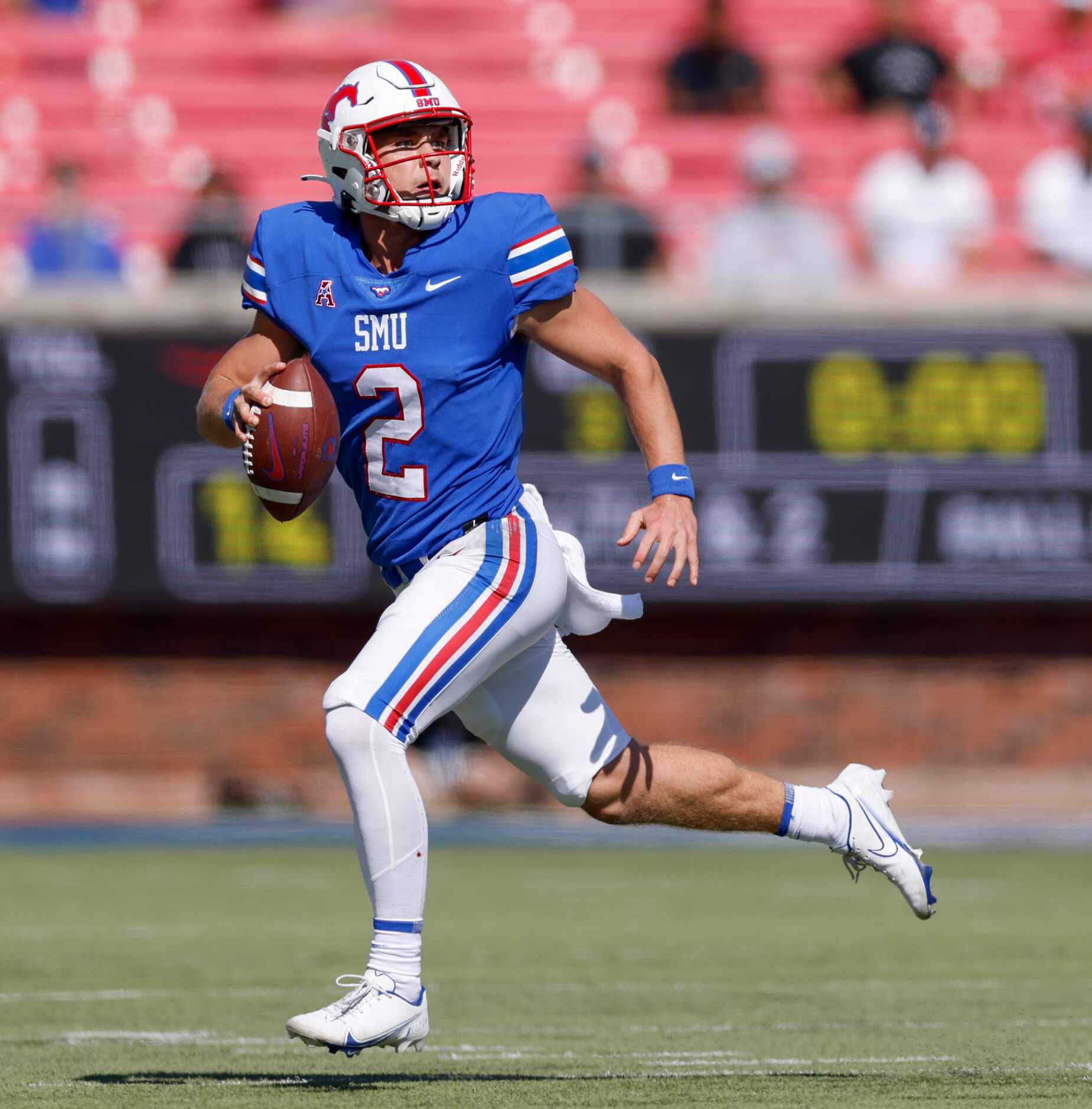 SMU quarterback Preston Stone (2) runs as he looks to throw the ball during the second half...