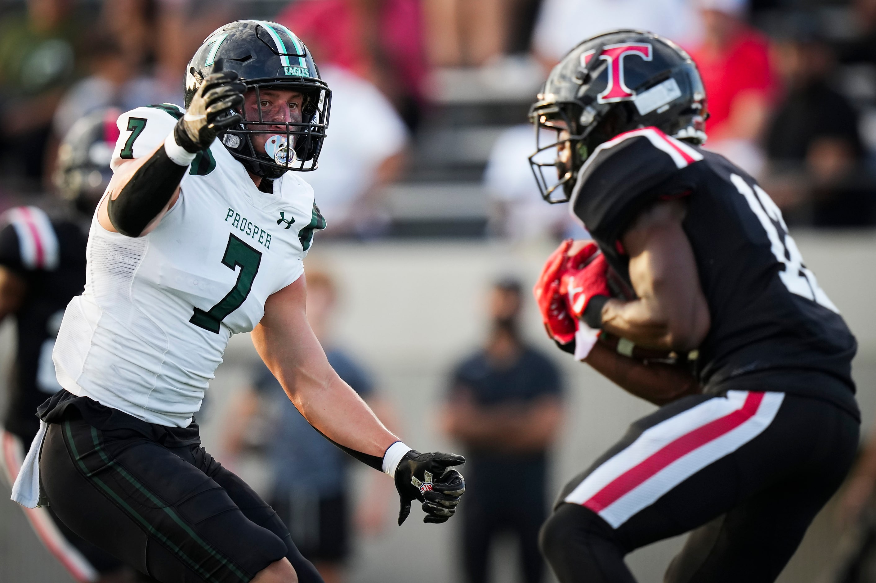 Euless Trinity defensive back Lamont Potts (12) intercepts a pass intended for Prosper’s...