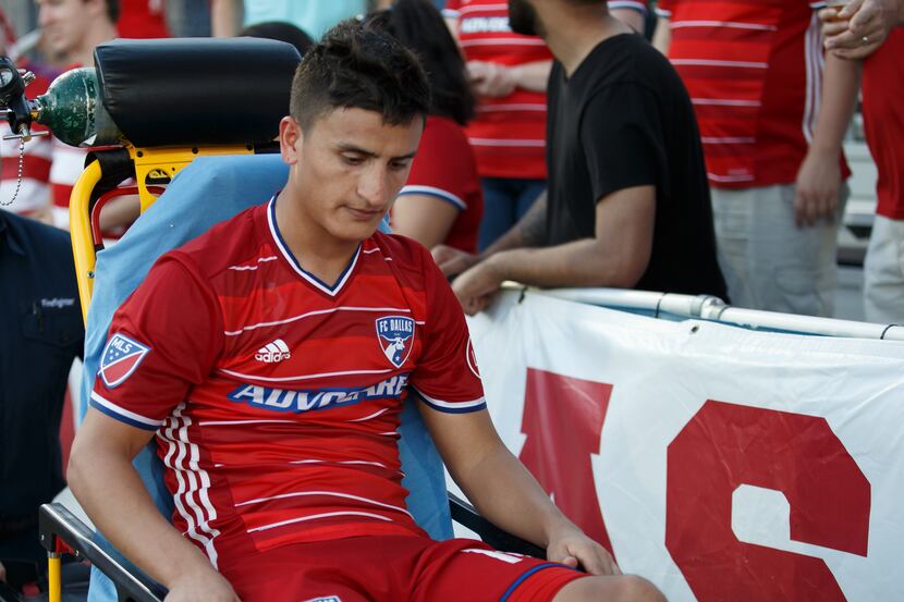 16 October 2016 - FC Dallas midfielder Mauro Diaz (#10) is wheeled off on a stretcher with...
