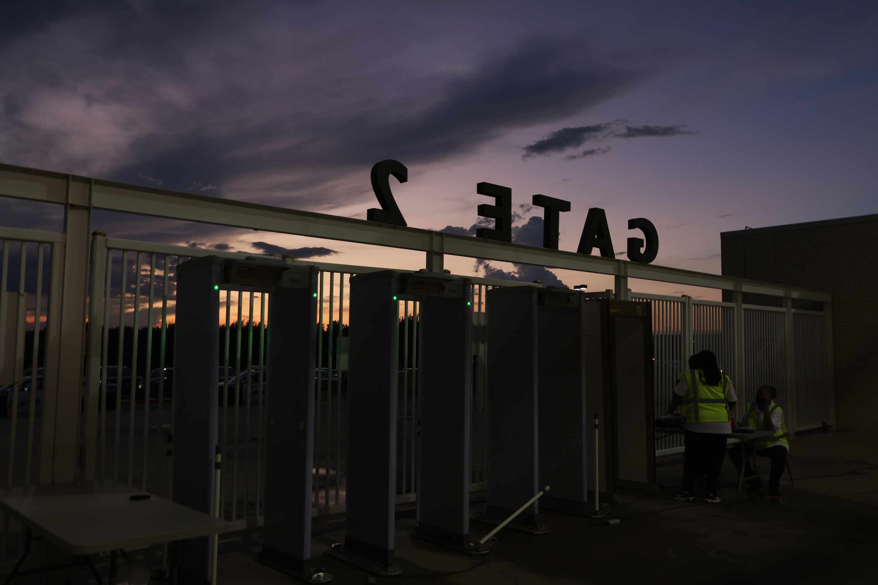 Gate 2 at Kincaide Stadium is framed by the sunset at halftime of the Dallas Carter versus...