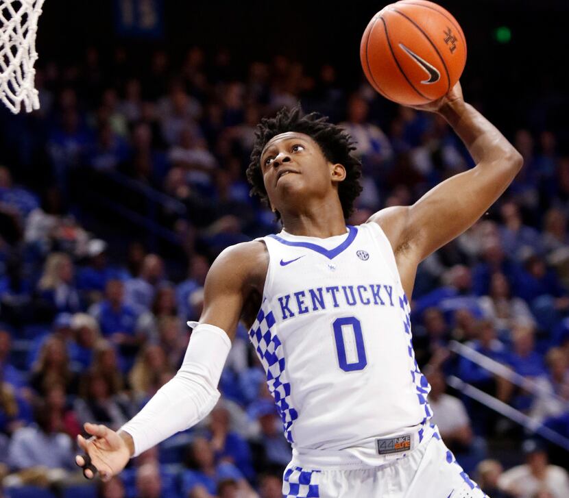 Kentucky's De'Aaron Fox goes up for a dunk during the second half of an NCAA college...