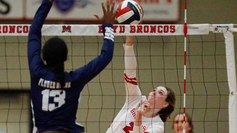 McKinney Boyd High School outside hitter Hannah Billeter (2) tries to get a hit as Flower...