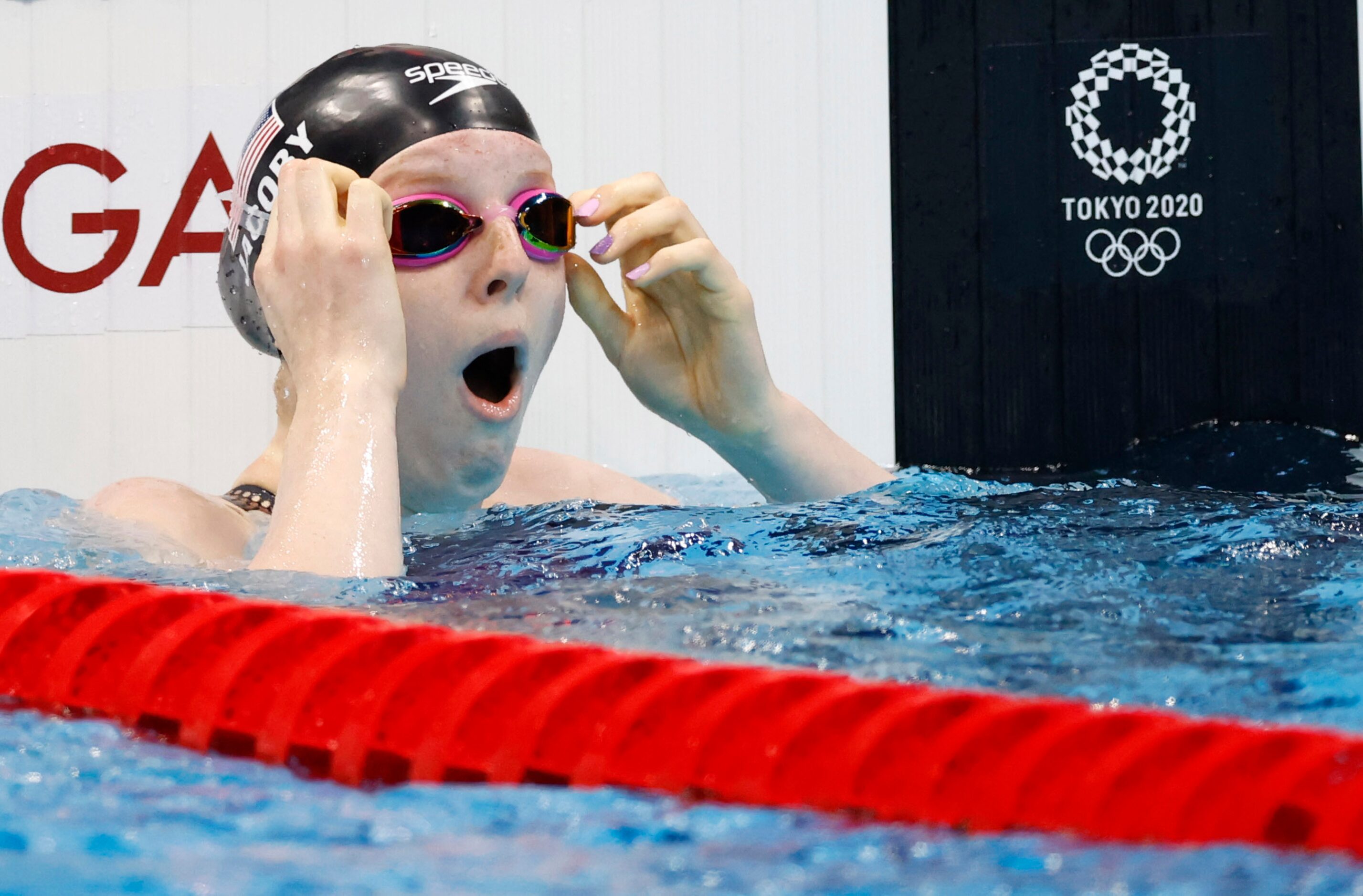 USA’s Lydia Jacoby reacts after noticing she won in the women’s 100 meter breaststroke final...