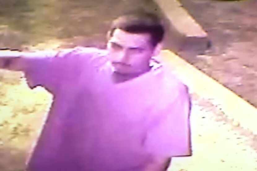 This image from a surveillance camera shows one of three men sought by Fort Worth police in...