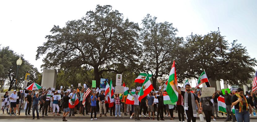 Protesters lined up along North Houston Street at Dealey Plaza in downtown Dallas on Sunday,...