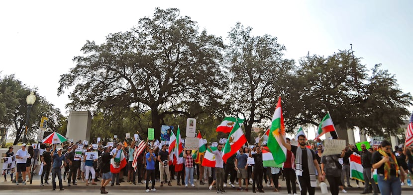 Protesters lined up along North Houston Street at Dealey Plaza in downtown Dallas on Sunday,...
