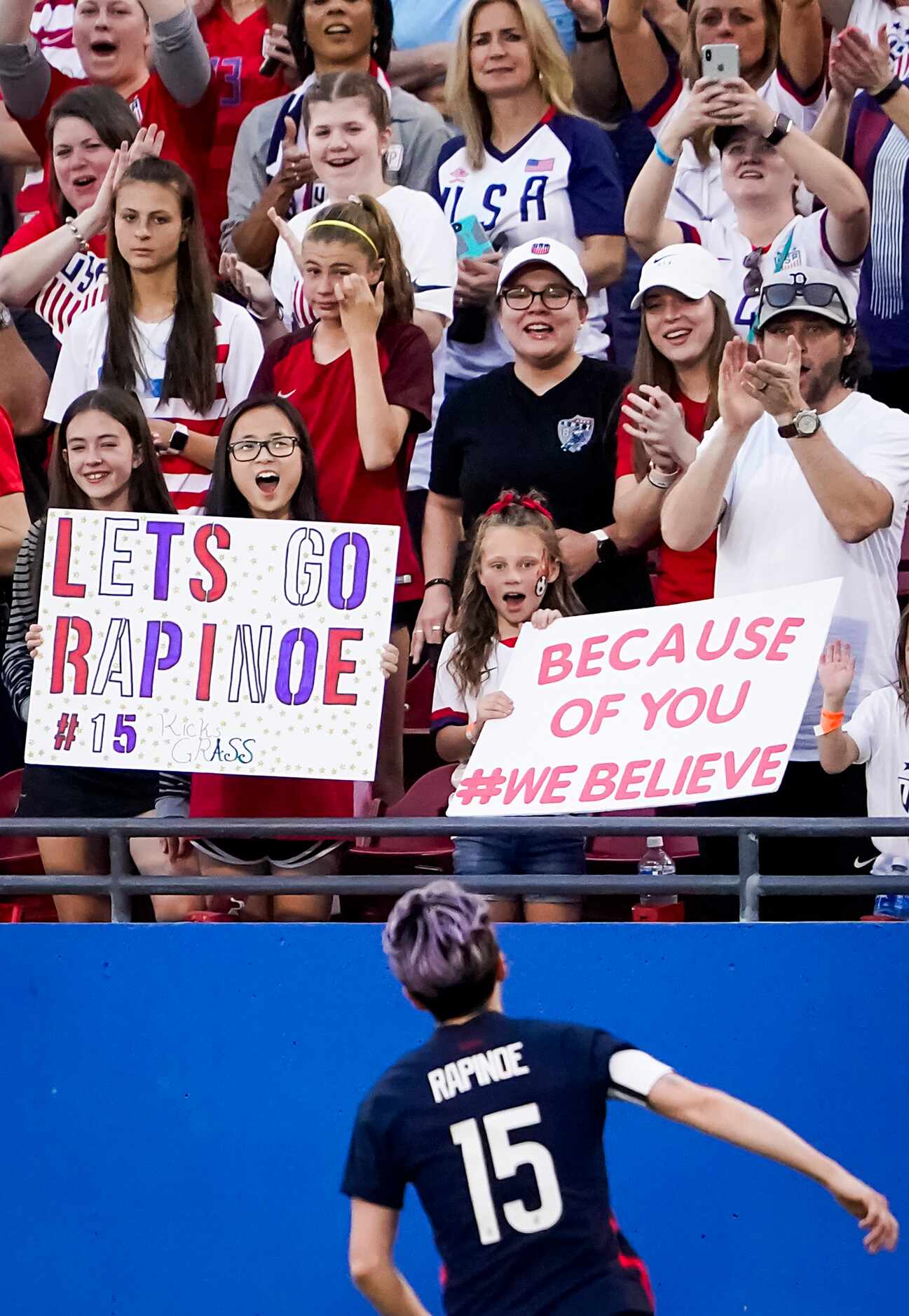 Fans cheer USA forward Megan Rapinoe after she scored on a free kick during the first half...