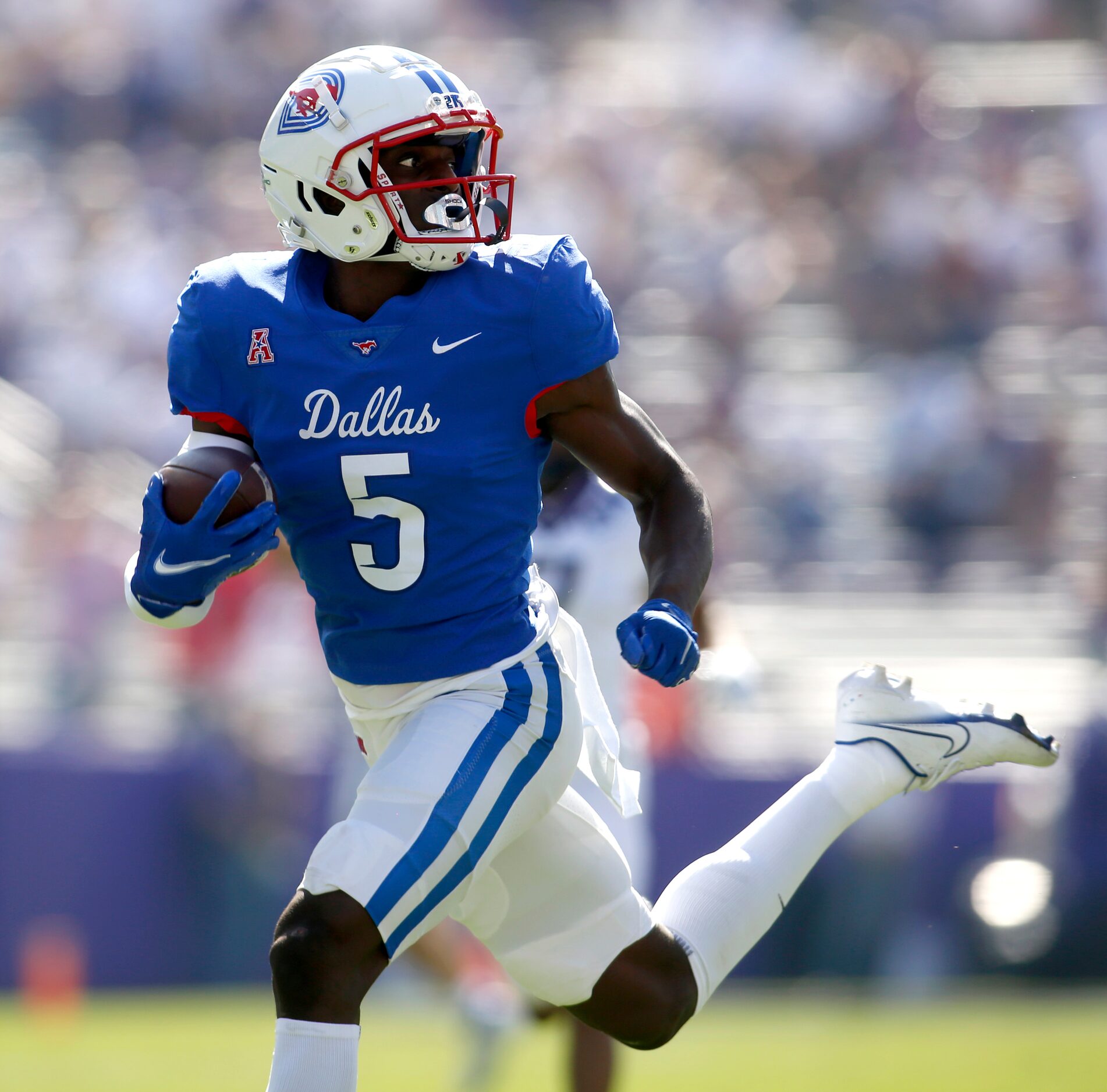 SMU receiver Danny Gray (5) looks over his shoulder as he crosses the goalie with a long...