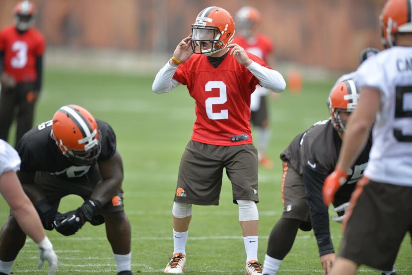 Cleveland Browns quarterback Johnny Manziel calls a play during NFL football minicamp in...