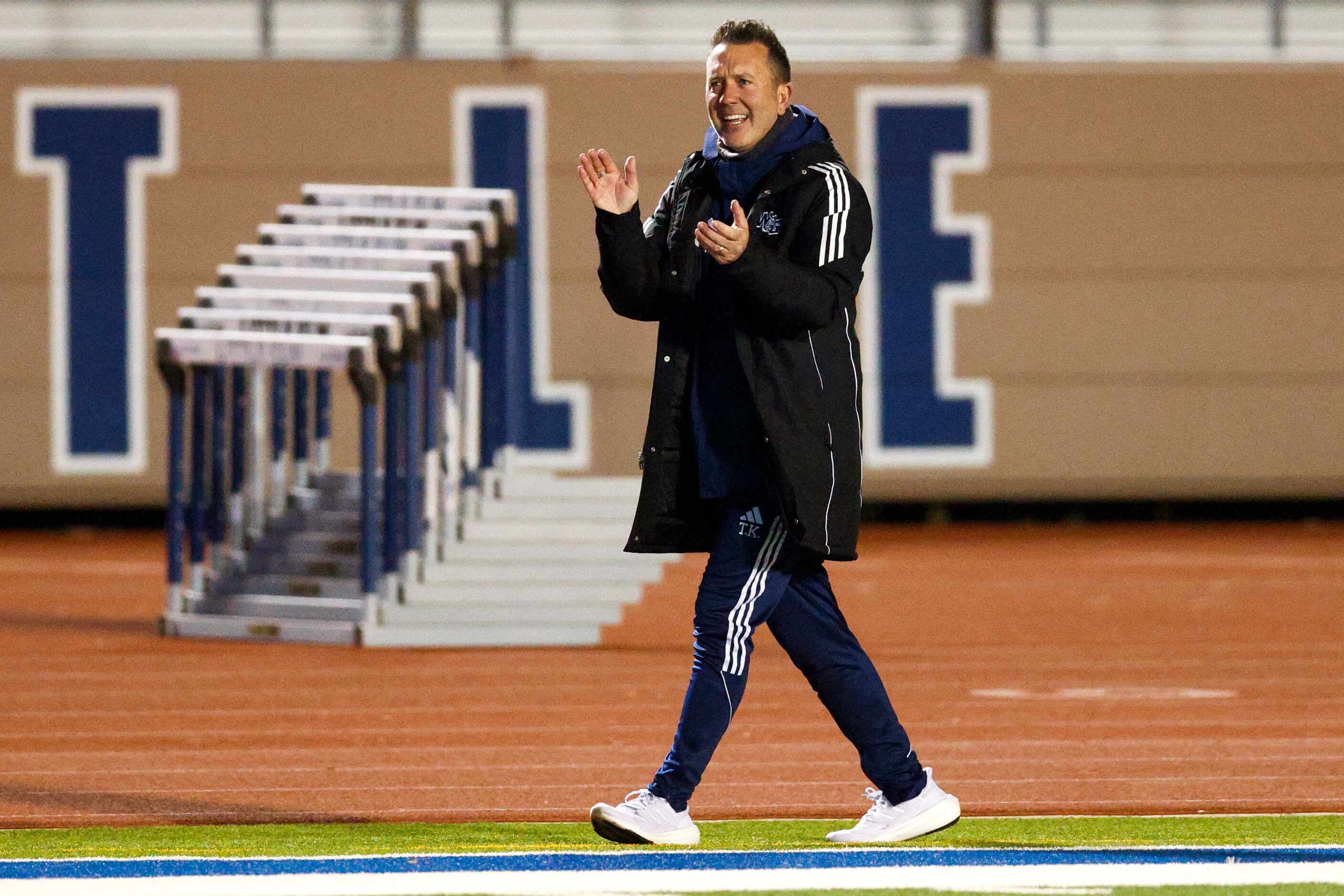 Prosper Walnut Grove head coach Trent Kutch celebrates a goal during the second half of a...