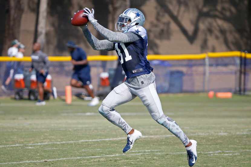 Dallas Cowboys cornerback Byron Jones catches the ball during the afternoon practice at the...