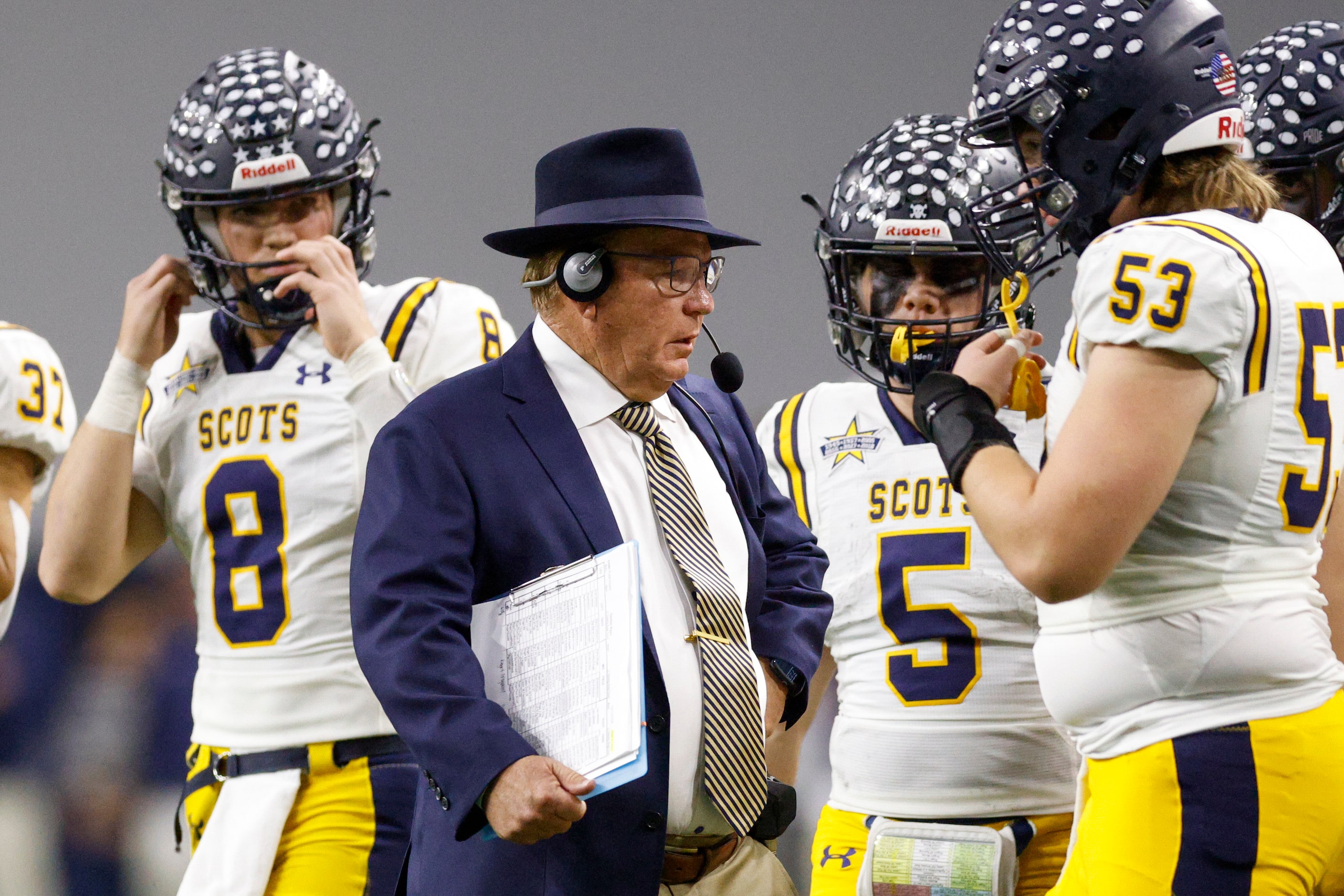 Highland Park head coach Randy Allen talks with his players during the first half of a Class...