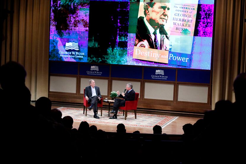 Former President George W. Bush and author Jon Meacham talk during a discussion of author...