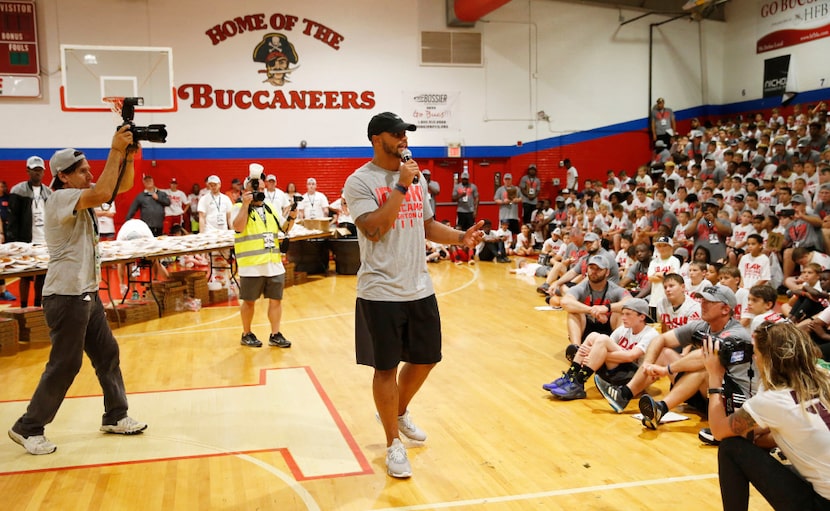 Dallas Cowboys quarterback Dak Prescott (4) talks to the 720 camp goers at the Dak Prescott...