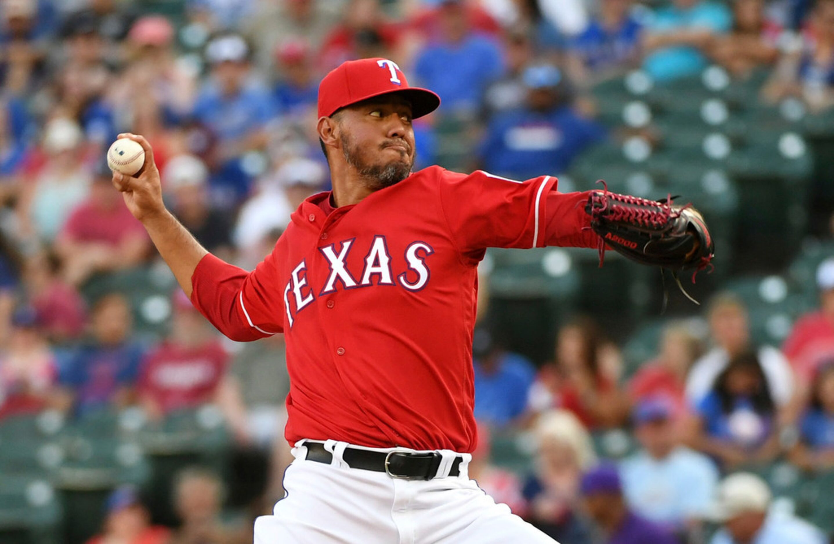 Texas Rangers starting pitcher Yovani Gallardo works against the Chicago White Sox during...