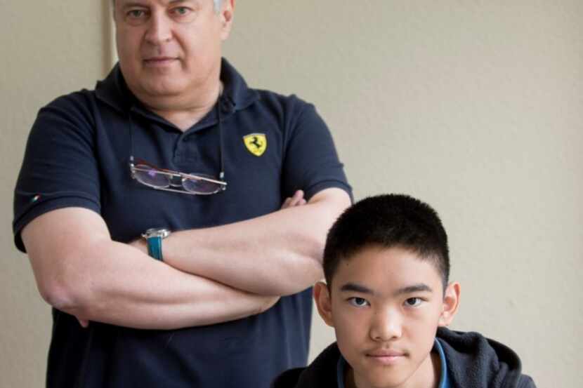  15-year-old chess Grand Master Jeffery Xiong, right, and coach Alexander Chernin at...