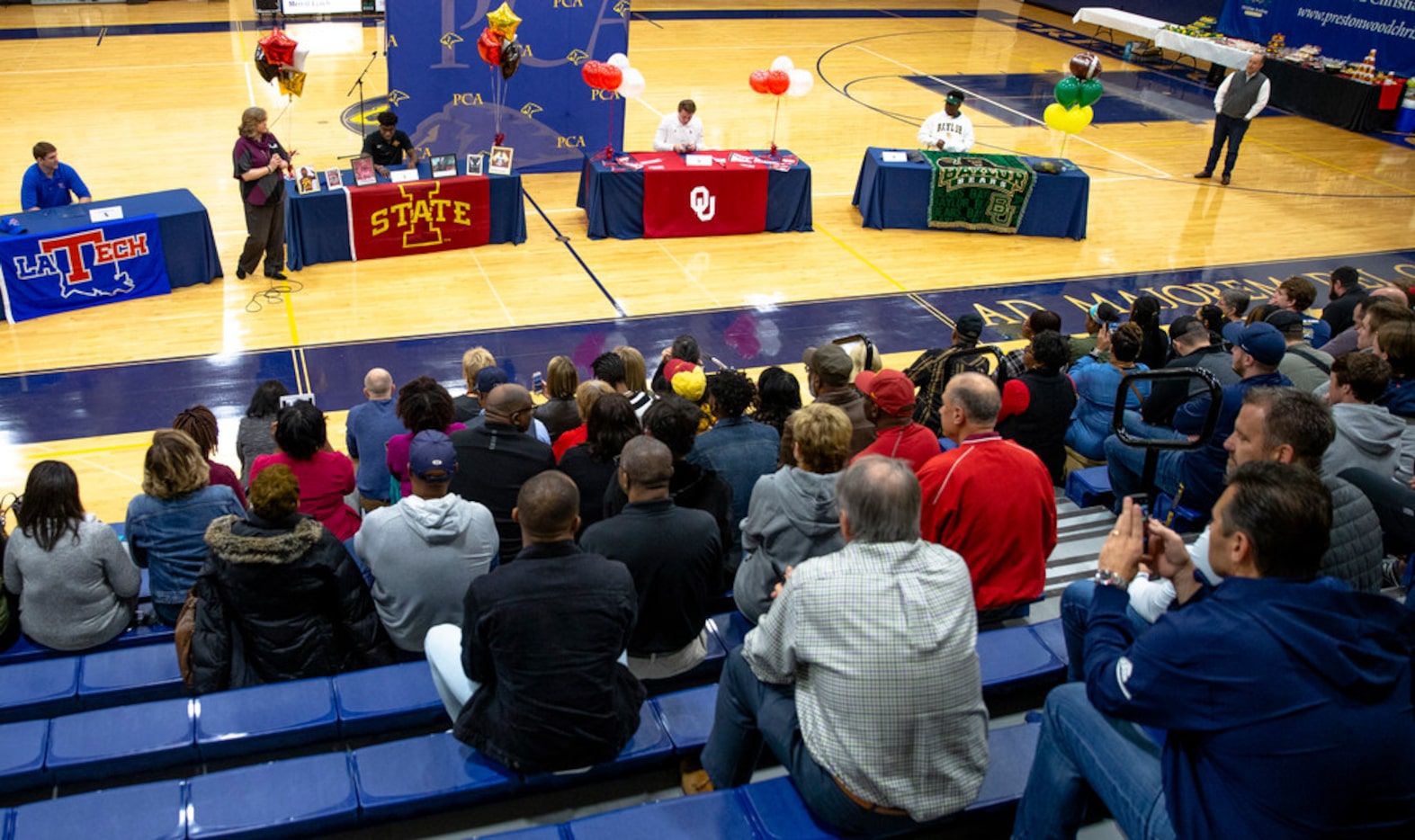 Family and friends watch as Jonah Brewster, Virdel Edwards, Austin Stogner, and Solomon...