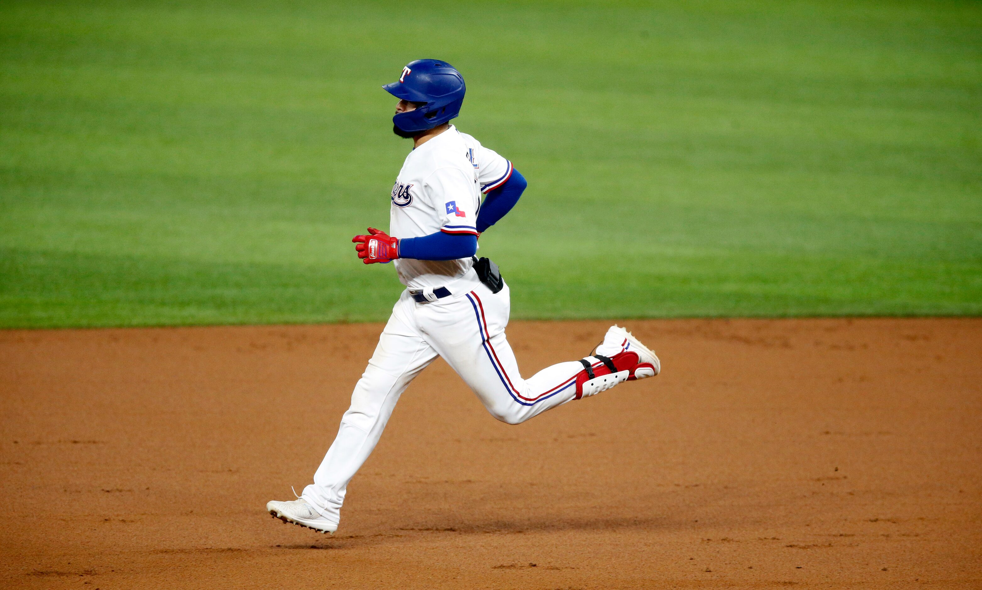 Texas Rangers Isiah Kiner-Falefa (9) rounds the bases after his second inning home run...