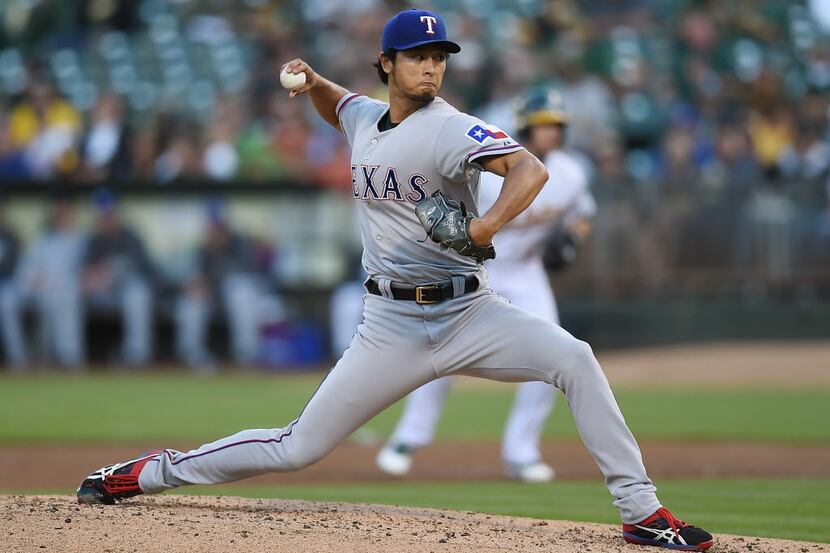 OAKLAND, CA - JUNE 17:  Yu Darvish #11 of the Texas Rangers pitches in the bottom of the...