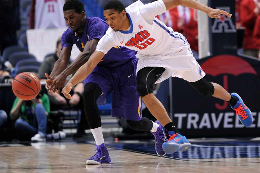 Southern Methodist Mustangs forward Ben Moore (00) steals a pass intended for East Carolina...
