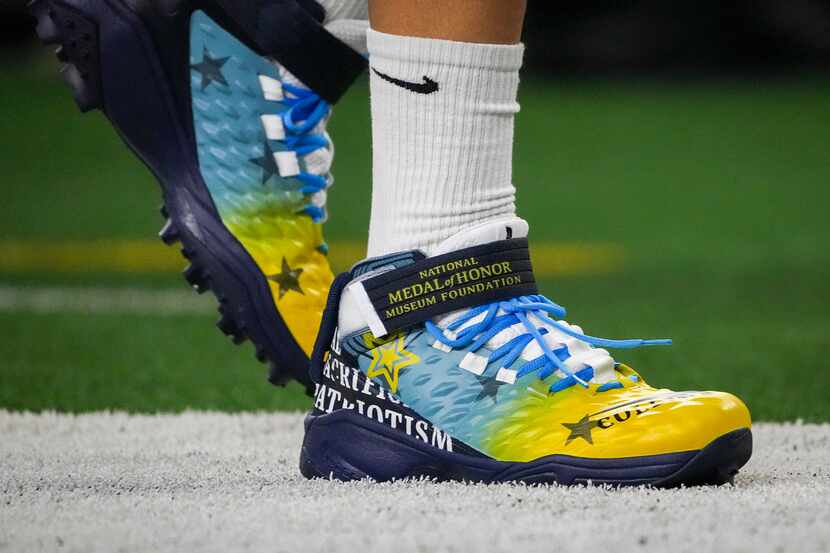 Dallas Cowboys offensive linemen wear cleats honoring the National Medal of Honor Museum...