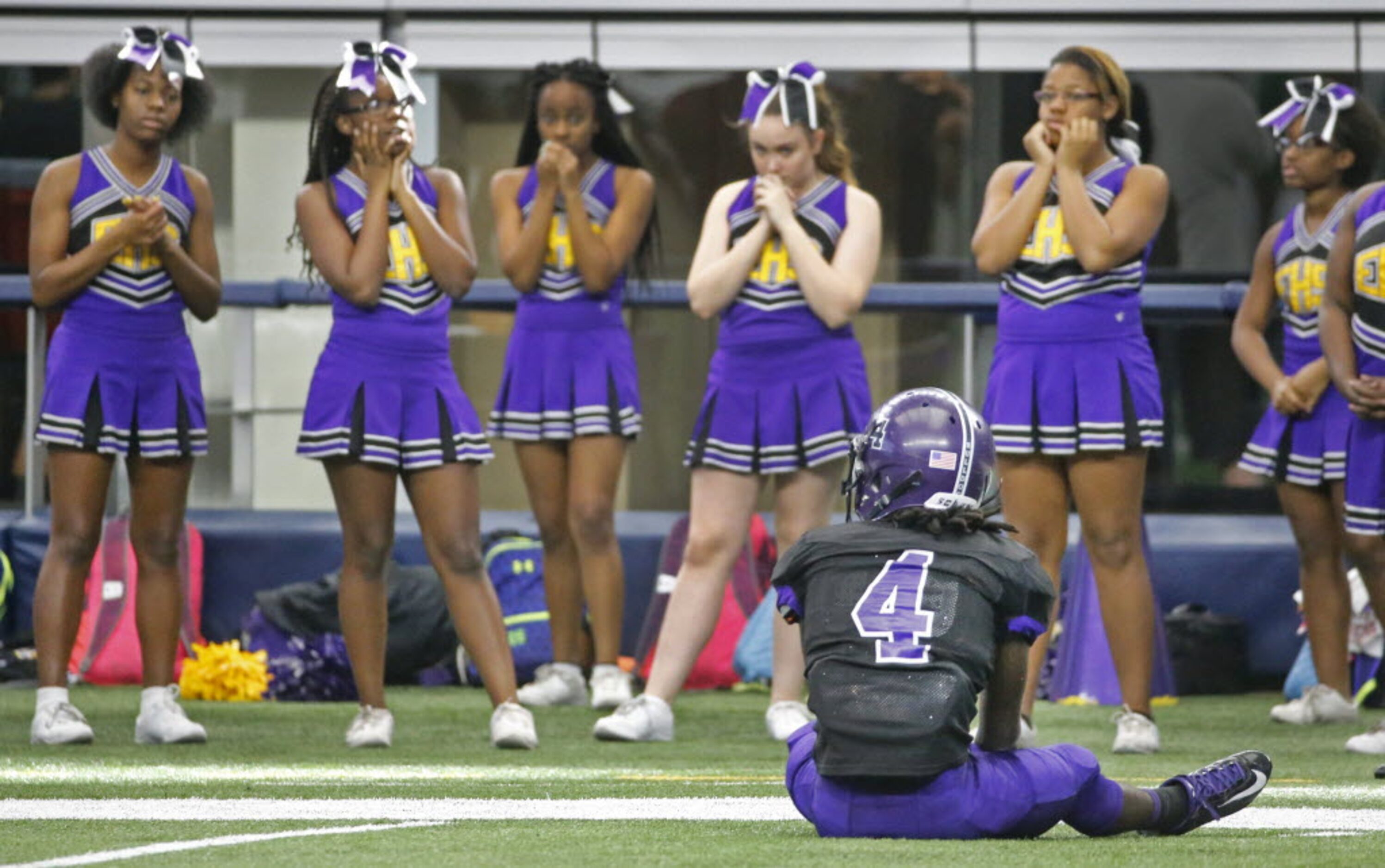 Everman receiver Jyron Hill (4) sits alone on the turf after failing to catch a desperation...