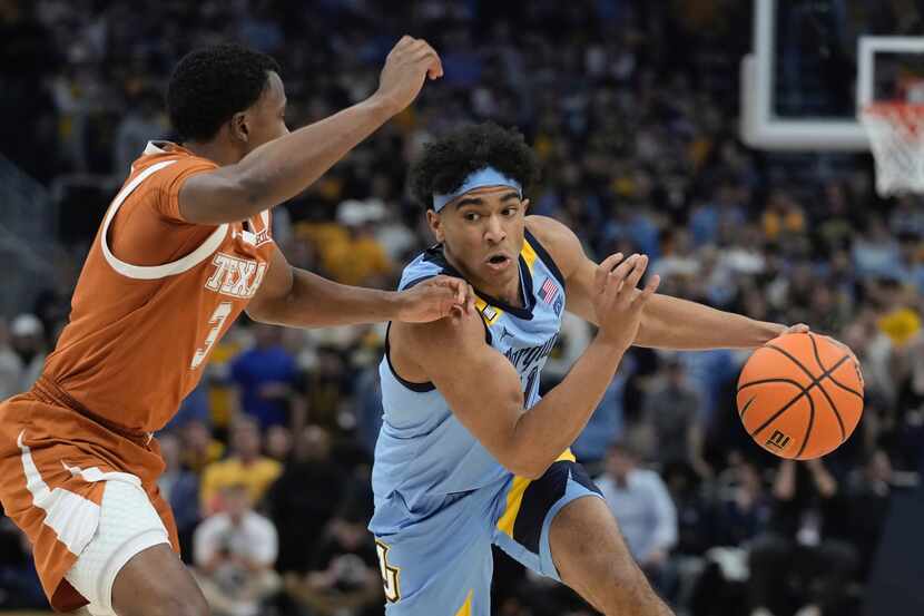 Marquette's Stevie Mitchell tries to get past Texas's Max Abmas during the first half of an...