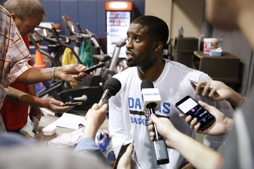 Wesley Matthews answers questions from reporters during Dallas Mavericks practice at...