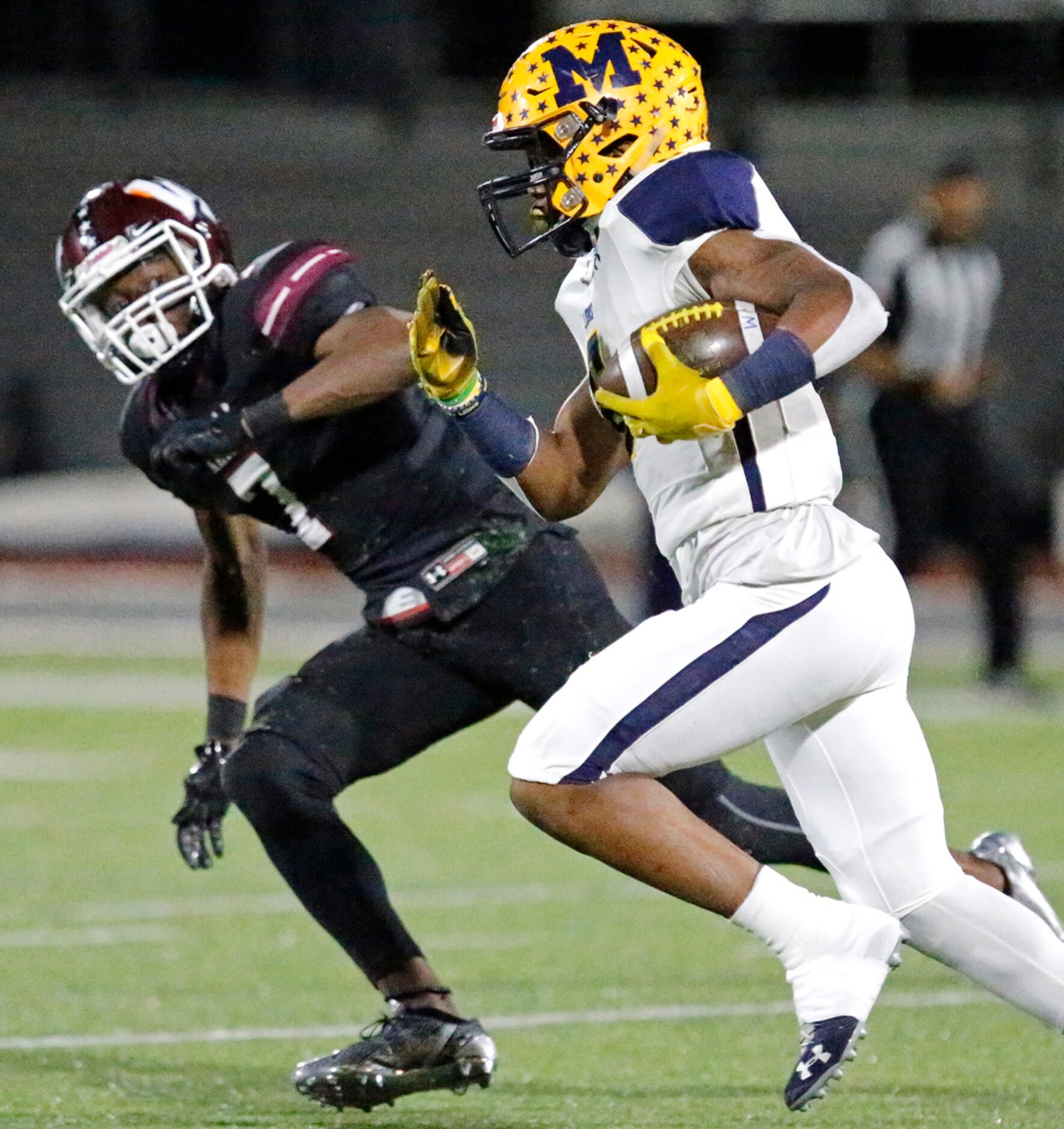 McKinney High School running back Cordrick Dunn (6) runs past Wylie High School defensive...