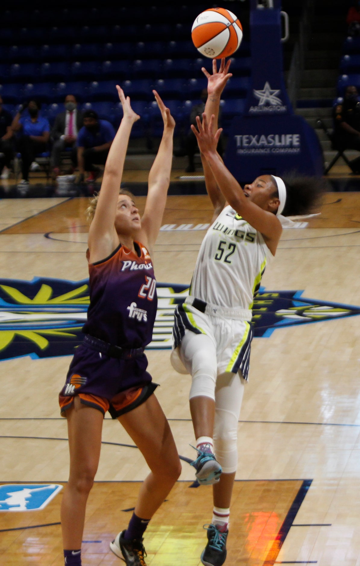 Dallas guard Tyasha Harris (52) gets off a jump shot over the defense of Phoenix guard Haley...