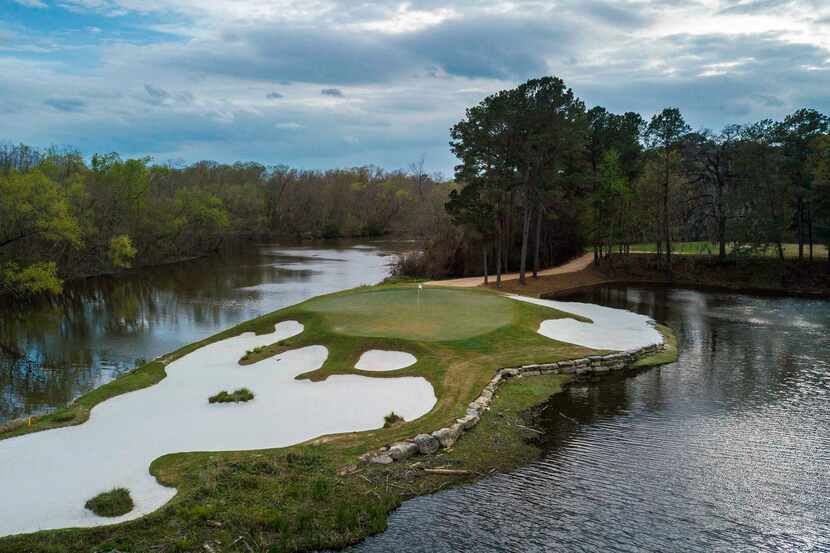 An aerial view of No. 15 at Whispering Pines Golf Club in Trinity, Texas, is a 179-yard...