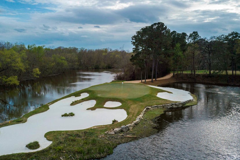 An aerial view of No. 15 at Whispering Pines Golf Club in Trinity, Texas, is a 179-yard...