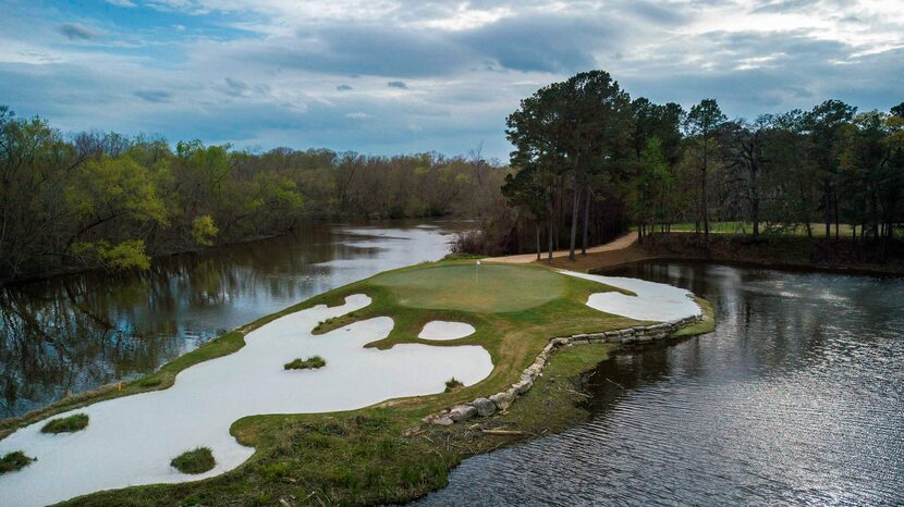 An aerial view of No. 15 at Whispering Pines Golf Club in Trinity, Texas, is a 179-yard...