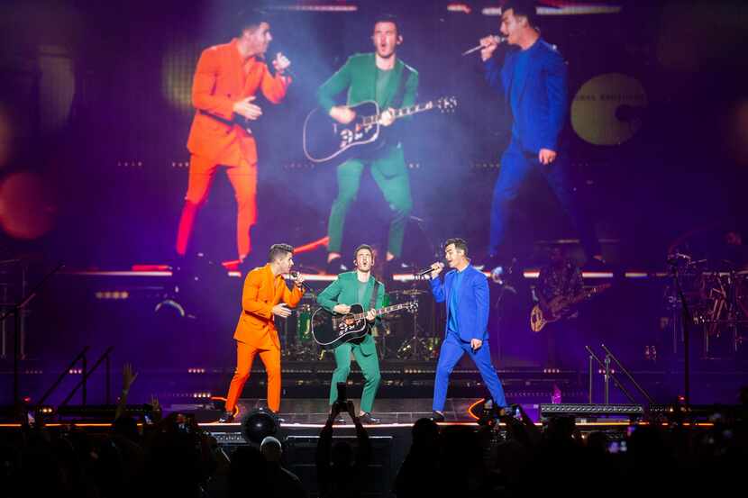 Jonas Brothers members Nick Jonas, left, Kevin Jonas, middle, and Joe Jonas, right, perform...