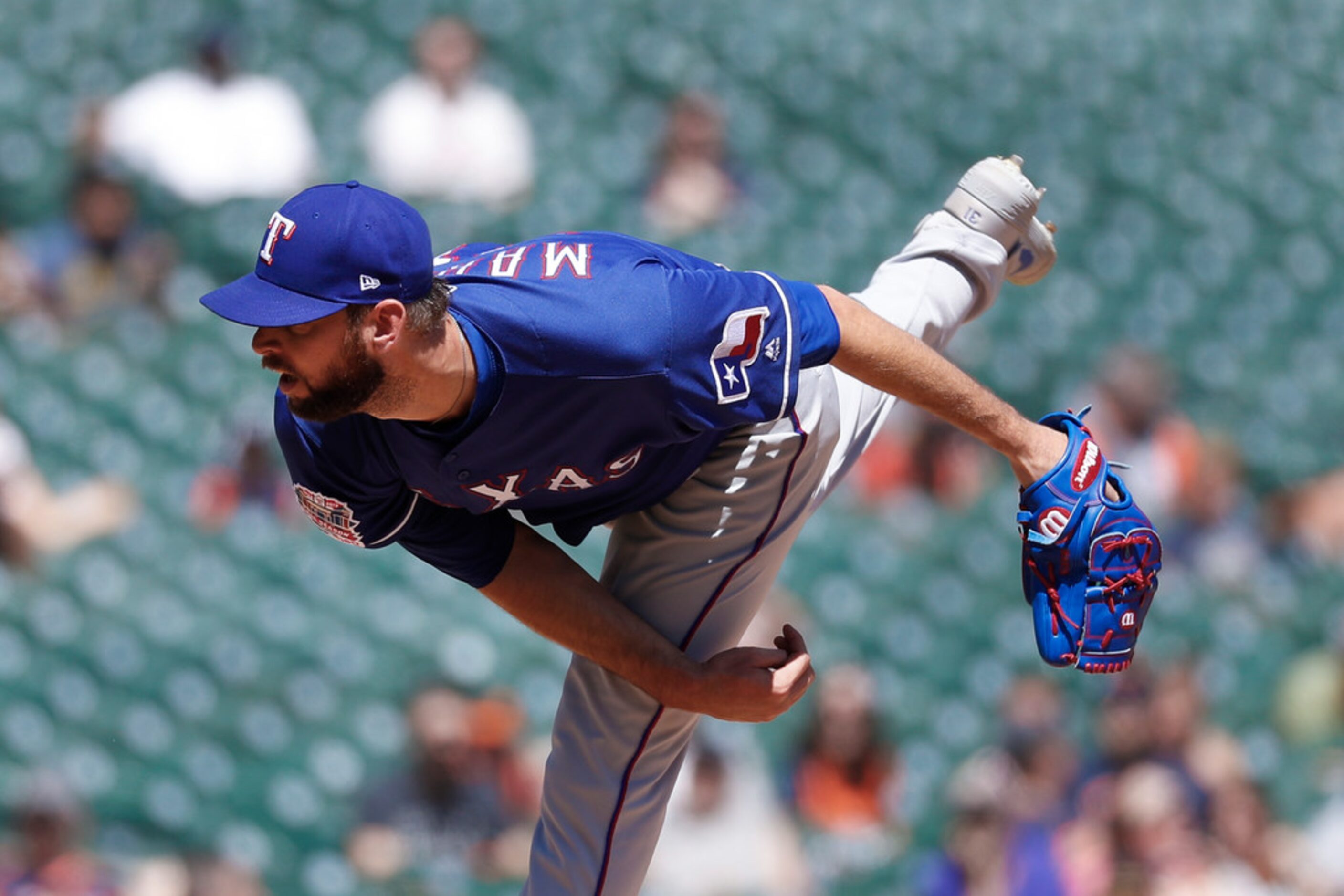 Texas Rangers relief pitcher Chris Martin throws in the eighth inning of a baseball game...