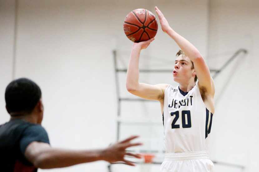 Jesuit guard Michael Jankovich (20) makes a 3-point shot in the first quarter during a...