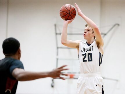 FILE - Jesuit guard Michael Jankovich (20) makes a 3-pointer in the first quarter of a...