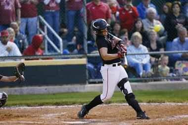 Lovejoy High School softball player Alyssa DiFiore (13) hits a home run during the bottom of...