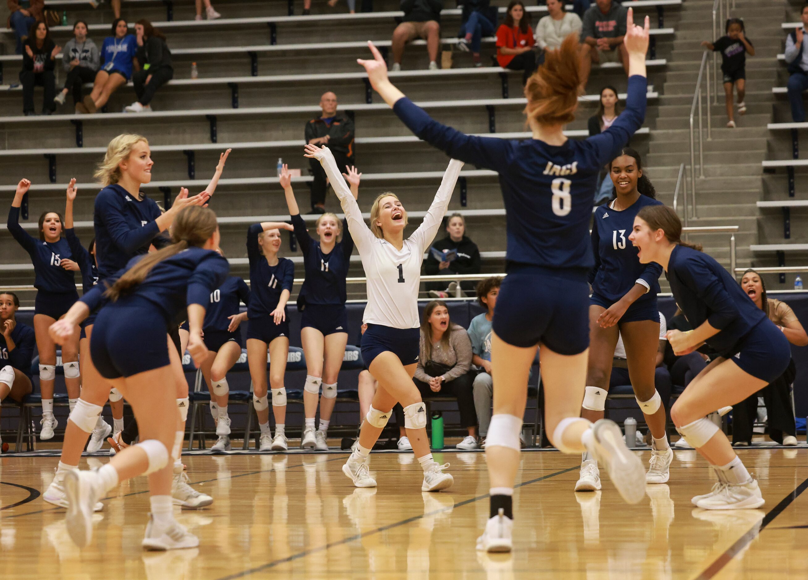 Flower Mound High School Emerson Dement (1) cheers as Flower Mound ties up the volleyball...