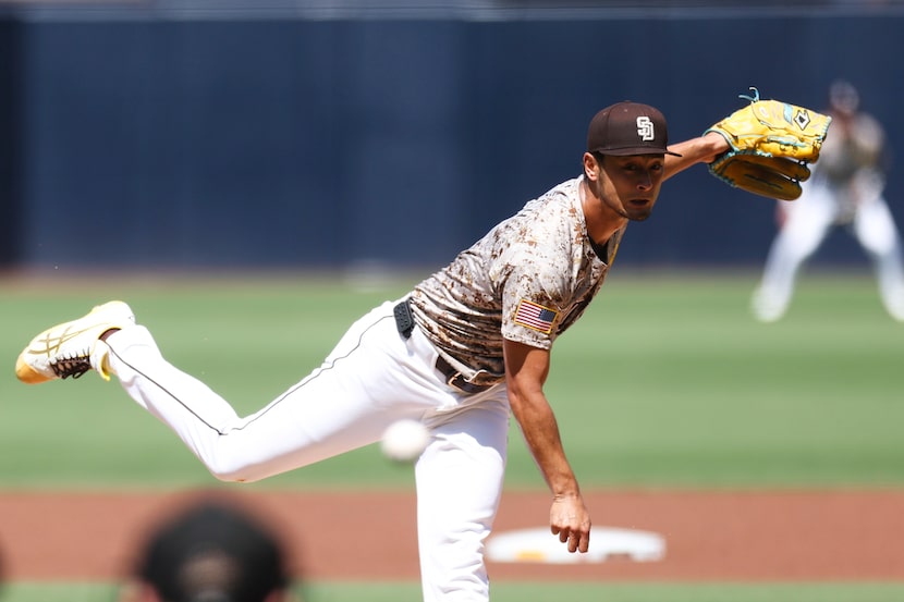 San Diego Padres' Yu Darvish follows through on a pitch by a Chicago White Sox batter in the...