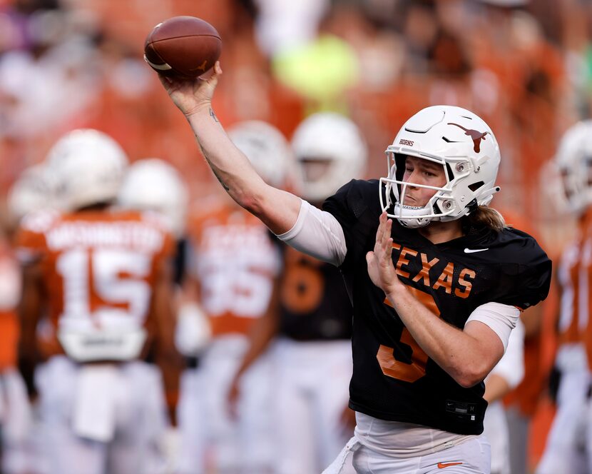 Texas Longhorns quarterback Quinn Ewers (3) throws a pass during warmups before the...