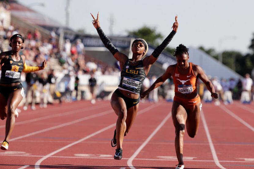 LSU's Sha'Carri Richardson (center) celebrates as she wins the women's 100 meters during the...