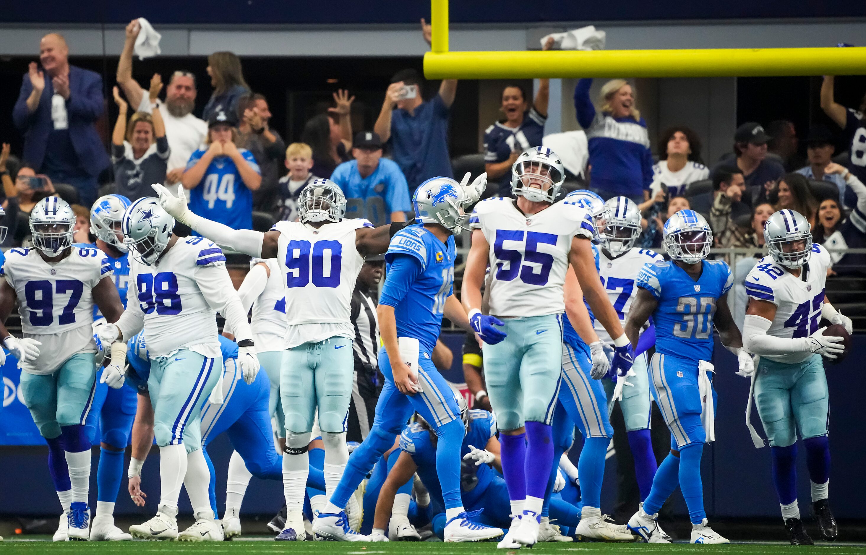 Dallas Cowboys defensive end DeMarcus Lawrence (90) and linebacker Leighton Vander Esch (55)...